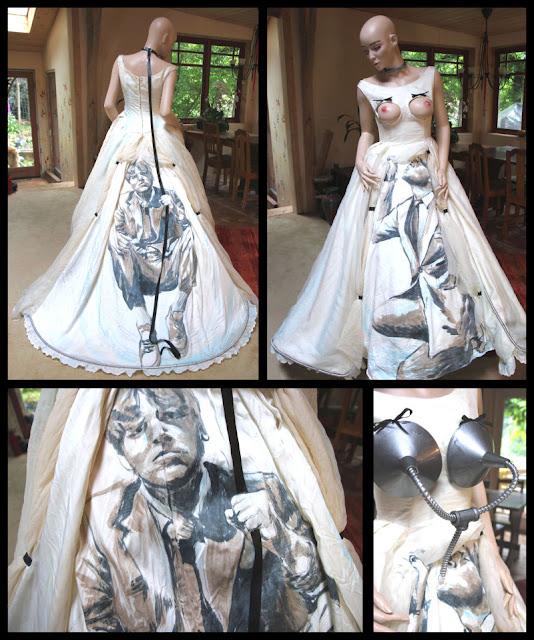 A grid with four views of the same dress, displayed on a mannequin with a bald head and eyebrows. First the back view of the dress shows the over-dress pulled up with small ties, to reveal the portrait of a man painted on the underdress. He's sitting on the train, wearing runners and a suit, looking out as if he's lost and sad. He's holding a real black leash that goes up to a black collar, worn by the mannequin. 
In the next quadrant of the image, the front of the dress is shown. Once again the overskirt is pulled up to reveal a man painted on the underskirt. This time he's holding the overskirt up with his hand while reaching his lips upward towards the bodice. The bodice has two round holes with black bows at the top, where the mannequins perfect round plastic breasts protrude. The nipples have been painted realistically. 
In the bottom left quadrant there is a close-up view of the man on the back of the dress, looking sadly but questioningly out at the viewer. 
In the bottom right quadrant of the image, the man on the front of the dress is shown again, but this time there is an industrial-looking device attached to the breast-holes, covering the breasts with funnels that lead to a tube, which goes into the mouth of the man. So it looks like he's being breasfed by some kind of milking-device.